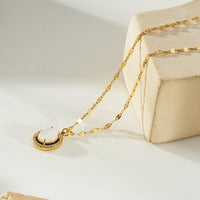 HAMMELA Gold: Pendant Necklace with a Pearl Centre & Crystal Halo