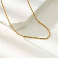 SKAGWAY: Minimalist Twisted Textures Chain Necklace in Gold